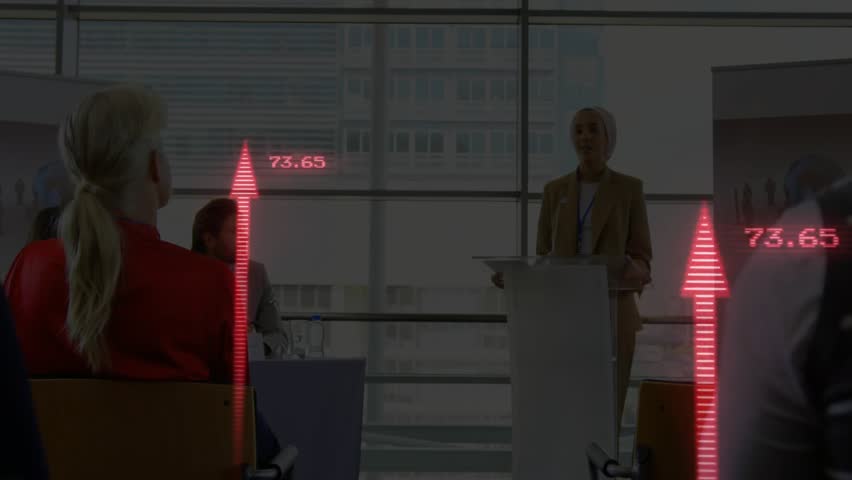 presenter speaking at podium starting red arrow overlay rising numeric labels for business growth. Professional, analytics, corporate, data visualization, business, leadership, communication - Powered by Shutterstock - Get 15% off with code: PIKWIZARD15