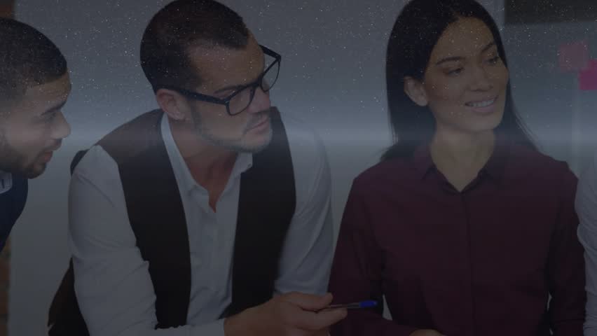 Business team reviewing data activating data holograms; man pointing stylus, woman swiping tablet. Technology, collaboration, innovation, futuristic, analytics, digital, professional - Powered by Shutterstock - Get 15% off with code: PIKWIZARD15