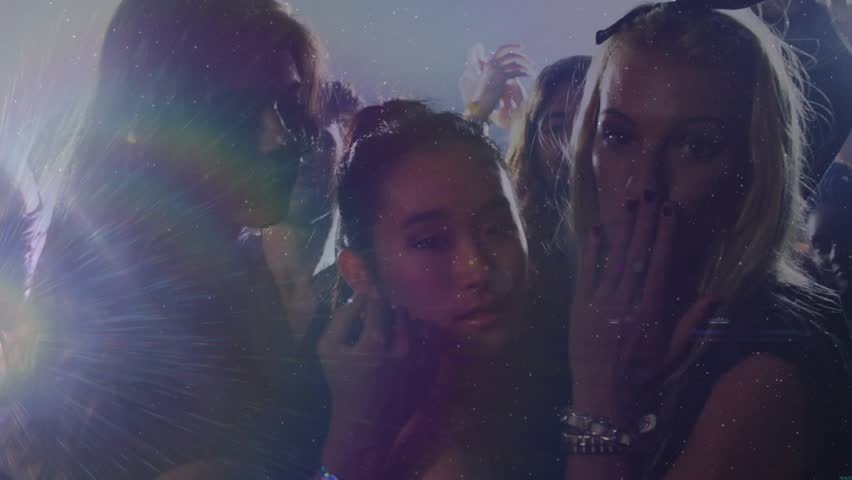 Three friends dancing in club promo showcasing vibe with strobe-triggered flares guiding gestures. Party, celebration, nightlife, urban, vibrant, energetic, camaraderie