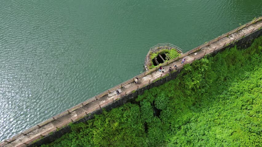 small dam full of water ariel circle view