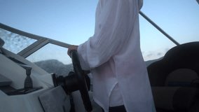 Boating cruising steering, control during scenic yacht journey at sunset - Powered by Shutterstock - Get 15% off with code: PIKWIZARD15