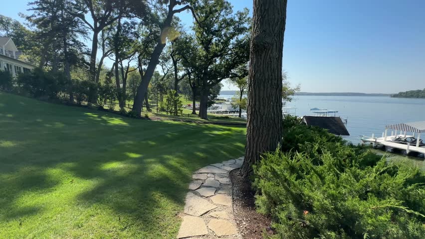 POV of A Person Walking In The Pathway To The Boat Pier In Lake Geneva, Wisconsin, USA.