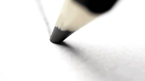 An extreme close up macro shot of a black pencil tip drawing a straight line on white paper. Concept of art, creativity, education, and writing. - Powered by Shutterstock - Get 15% off with code: PIKWIZARD15