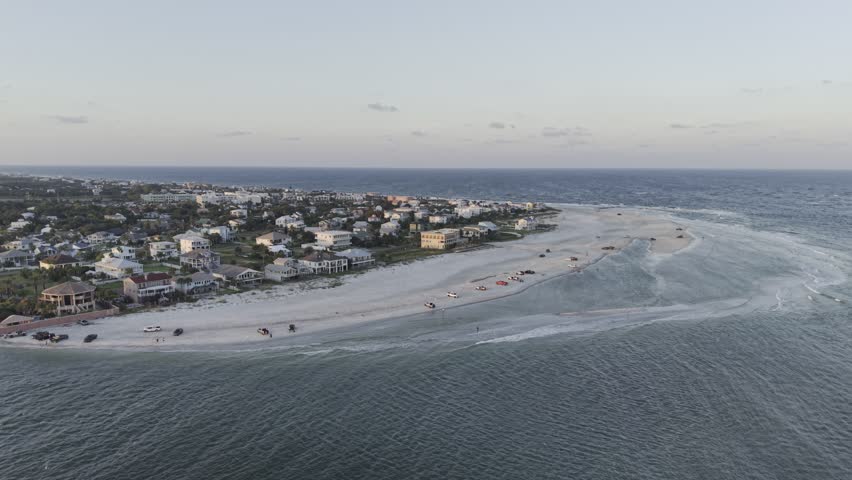 Aerial view of the tranquil Vilano Beach coastline, where the azure ocean meets the sandy beach, revealing a coastal community, Vilano Beach, Florida, United States.