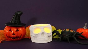 Halloween composition, blow out of a skull candle on dark purple background - Powered by Shutterstock - Get 15% off with code: PIKWIZARD15