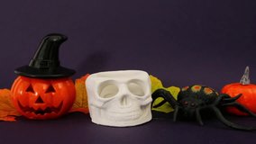 Halloween composition, blow out of a skull candle on dark purple background - Powered by Shutterstock - Get 15% off with code: PIKWIZARD15