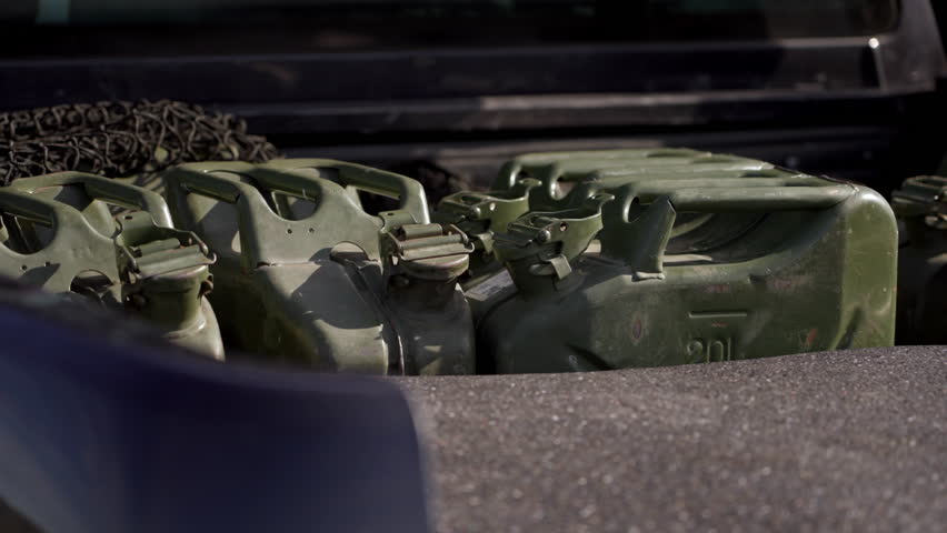 Metal fuel canisters in pickup trunk