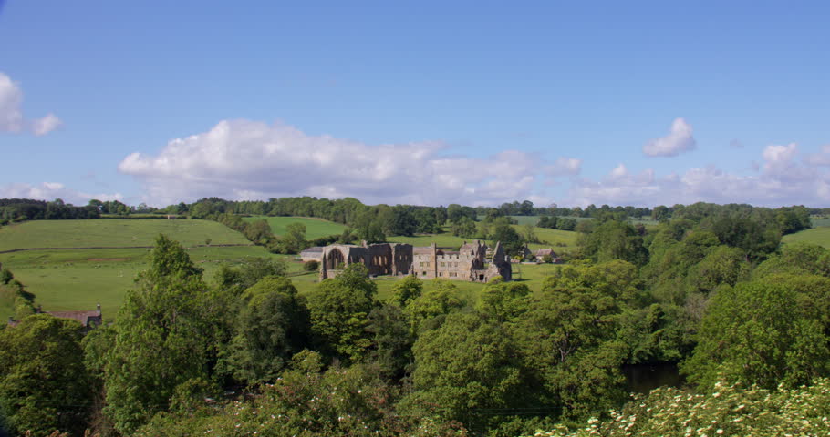 Extra wide shot of Egglestone abbey with trees in foreground