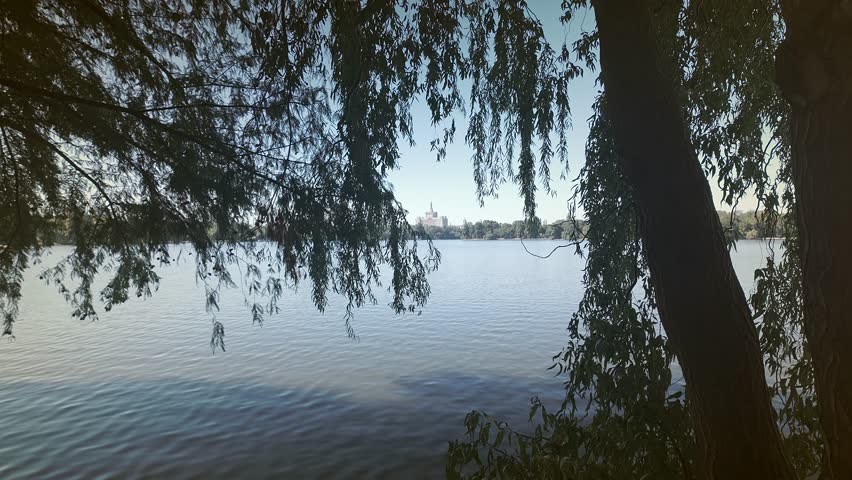 Bucharest House of Free Press landmark building from park lakeside