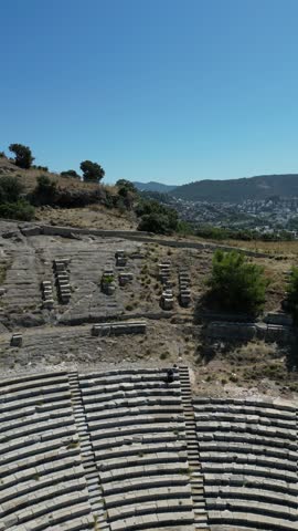 Aerial view of the ancient Bodrum Antique Theatre, with its stone seating and historic architecture, Bodrum, Mugla, Turkey.