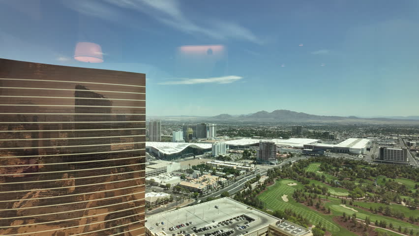 City buildings seen through window of Wynn Hotel, time lapse, in Las Vegas, Nevada, USA.