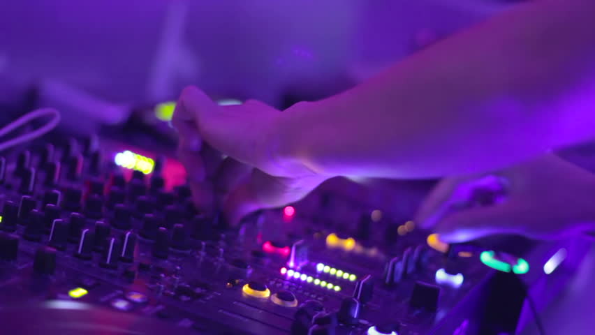 Classy DJ hands movement during party in night club