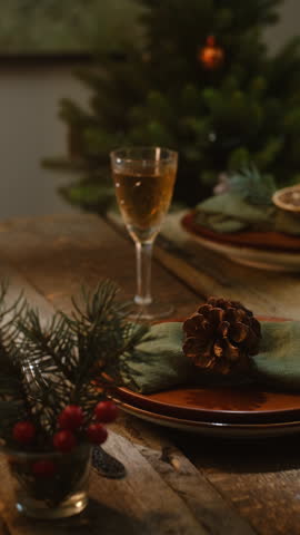 Vertical video. Holiday table setup for Christmas. Winter themed table decor