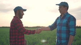 Handshake on green field proves partnership trust. Sunset behind farmer handshake seals agreement. Man handshake farmer strengthens business trust partnership on field showing success in teamwork deal - Powered by Shutterstock - Get 15% off with code: PIKWIZARD15