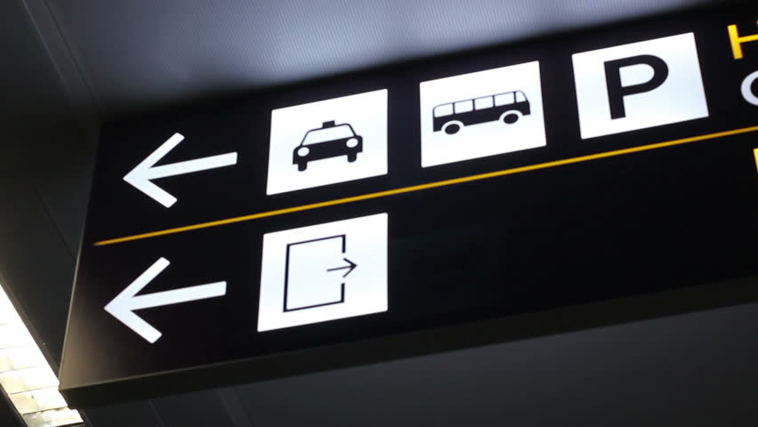 Airport directions sign: taxi, bus, parking, exit