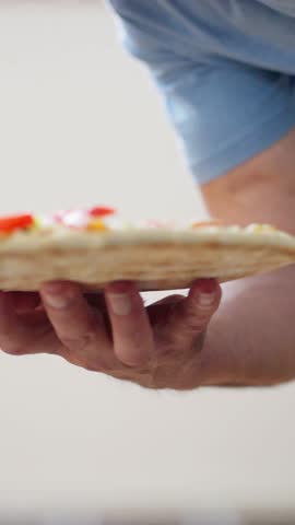 A mouthwatering pizza topped with colorful veggies and aromatic herbs, perfect for all food lovers