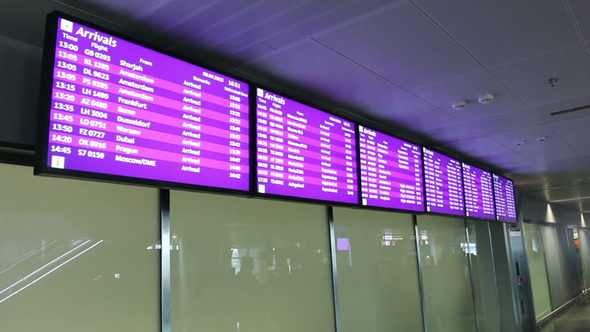 Information screens at airport lobby. Flight arrivals and departures screen