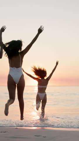 Running, sea and back of friends at beach for summer vacation, travel adventure and freedom. Tropical destination, sunset and celebration with group of people for tourism, holiday and bonding