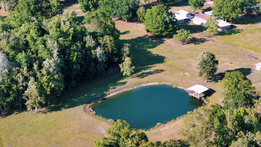 Aerial landscape of forest and pond running trail in suburban Baldwin Jacksonville Florida USA