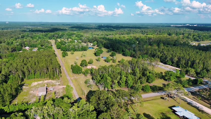 Aerial landscape of forest and pond running trail in suburban Baldwin Jacksonville Florida USA