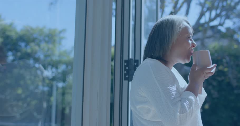 Senior woman raising mug savoring drink sparking math equations evolving in education at glass door. Mindfulness, serenity, contemplation, tranquility, elegance, intellect, outdoor