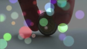 Human finger flicking euro coin flipping onto rim, spinning wobbling on grey surface for physics. Motion, currency, metallic, dynamics, minimalism, abstract, resonance - Powered by Shutterstock - Get 15% off with code: PIKWIZARD15