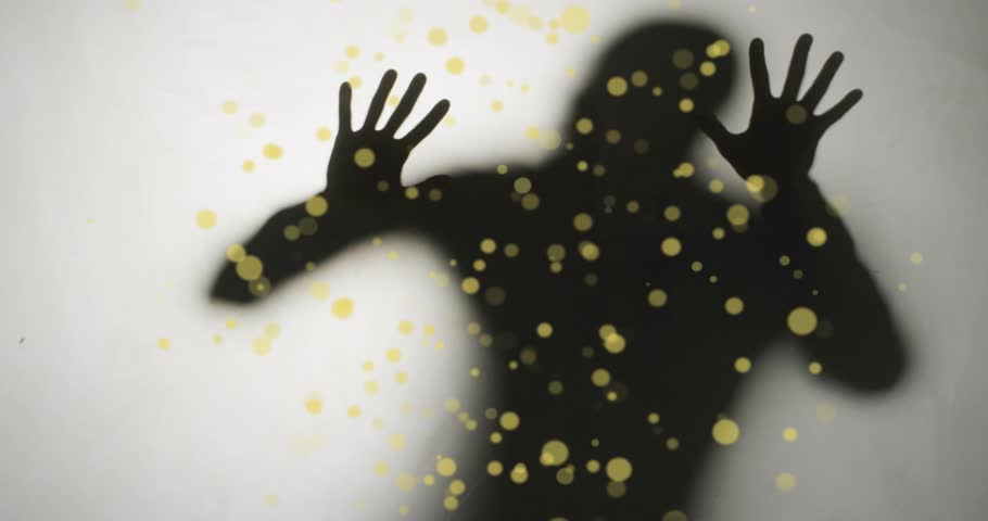 Silhouette appearing behind translucent panel pressing panel shaping golden particles for tech demo. Minimalist, abstract, futuristic, dynamic, innovative, digital, elegant