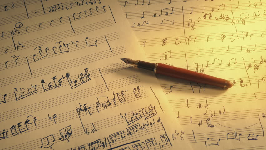 Music Writing Scene With Hand-Written Sheets