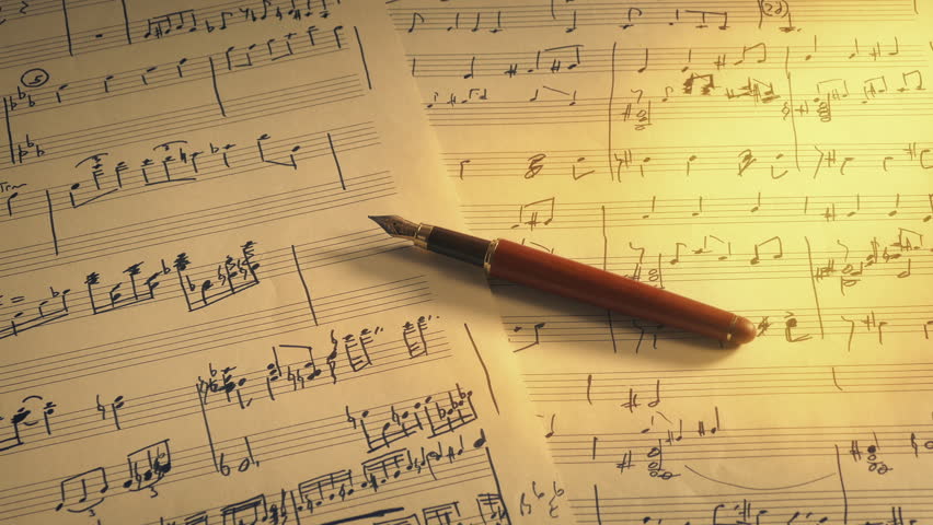Music Writing Scene With Hand-Written Sheets