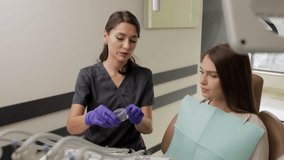 Dentist wearing rubber gloves holding transparent aligners for teeth correction for a patient in dentistry clinic - Powered by Shutterstock - Get 15% off with code: PIKWIZARD15