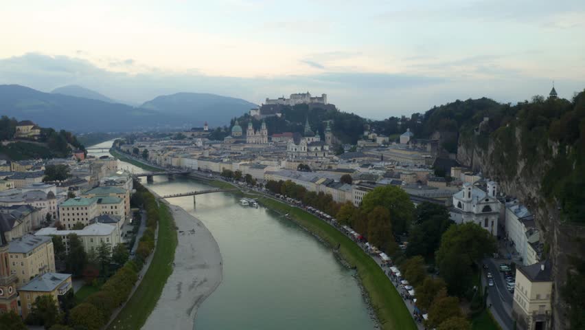 Explore the stunning aerial views of Salzburgs historic cityscape and mountains