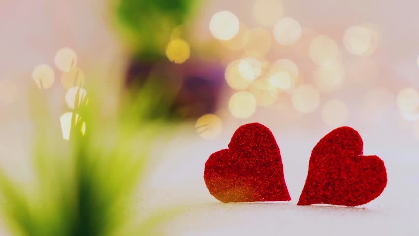 A romantic scene of two vibrant red hearts on a soft, blurry background. Perfect for visualizing eternal love, deep connection, and heartfelt promises. "My heart is always yours."