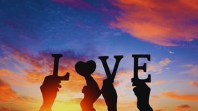 A heartfelt image of love lettering held carefully in hands against a warm sunset background, symbolizing timeless promises and romantic commitments. - Powered by Shutterstock - Get 15% off with code: PIKWIZARD15