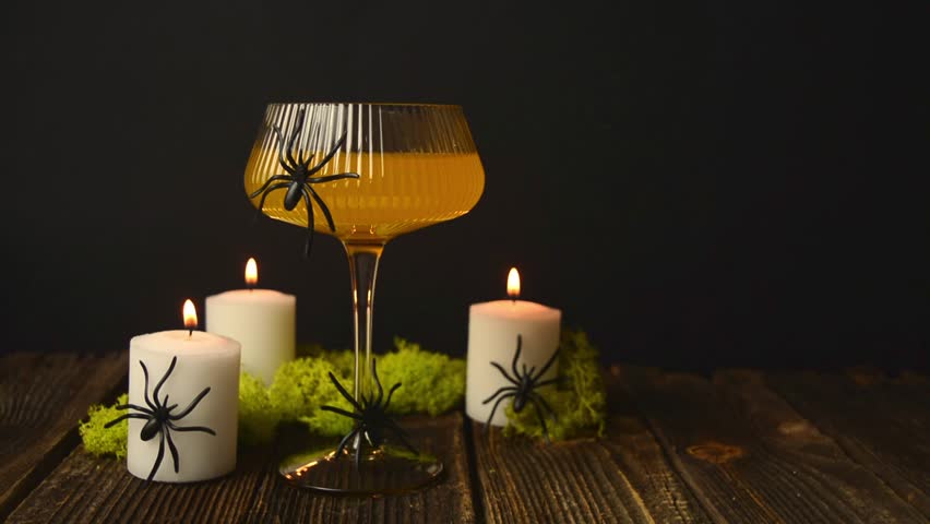 Halloween orange cocktail on a dark background. Halloween drink.