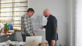 discussion about layout modifications and structural costs in detail, client and architect collaboratively review and analyze floorplan modifications and structural changes with detailed cost - Powered by Shutterstock - Get 15% off with code: PIKWIZARD15