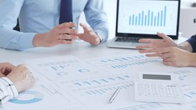 Business people having a financial meeting, discussing company strategy, reviewing data analysis, and planning future growth using charts and reports - Powered by Shutterstock - Get 15% off with code: PIKWIZARD15