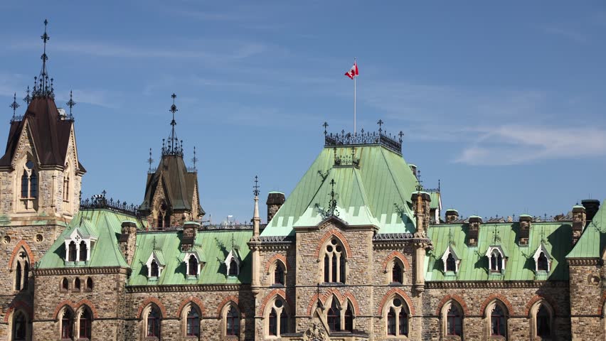 Parliament Hill, East Block building with Canadian flag in Ottawa, Canada.