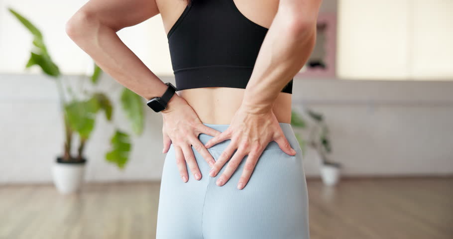 Back, stretching and woman in studio, fitness and wellness with posture, break and exercise. Person, healthy and training with workout, warm up and mobility with practice, prevent ache and pilates