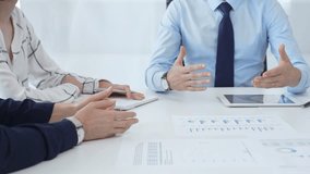 Business professionals reviewing financial metrics on digital screens, collaborating strategically while examining charts and graphs in contemporary workspace - Powered by Shutterstock - Get 15% off with code: PIKWIZARD15