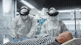 Doctors team in hazmat suits examining patient with infection symptoms in a secure laboratory, medical testing and diagnostics to prevent disease spread and support global healthcare. Camera B. - Powered by Shutterstock - Get 15% off with code: PIKWIZARD15