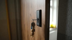 Woman Locks The Apartment's Front Door With A Key - Powered by Shutterstock - Get 15% off with code: PIKWIZARD15