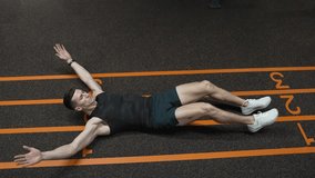 Sporty man training abs. Sixpack leg crunches exercise. Muscular sportsman do abs workout. Abdominal exercise. Exercise for abs sixpack torso muscle. Leg crunches man in training, 4k - Powered by Shutterstock - Get 15% off with code: PIKWIZARD15