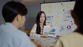 Asian businesswoman startup presenting data chart project management meeting with colleagues, financial report analysis teamwork strategy plan corporate success at office, marketing, data analytics - Powered by Shutterstock - Get 15% off with code: PIKWIZARD15