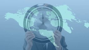 Executive lifting clock, map fading, glowing lines linking continents, showing time connectivity. Business, technology, innovation, global, futuristic, communication, networking - Powered by Shutterstock - Get 15% off with code: PIKWIZARD15