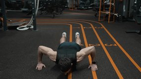 Sport workout footage. Athlete pushing up. Muscular sportsman with torso working out in gym. Sport man doing push ups exercise. Fitness and sport. Gym workout. Sportsman pushup in gym - Powered by Shutterstock - Get 15% off with code: PIKWIZARD15