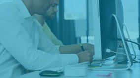 Two analysts jotting notes at screens as charts fading in and globe enhancing data analysis. Collaboration, technology, office, analysis, data, visualization, professional - Powered by Shutterstock - Get 15% off with code: PIKWIZARD15