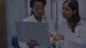 Lab scientists holding laptop using stylus activating holographic overlays for research analysis. Futuristic, collaboration, innovation, technology, education, analytics, professional - Powered by Shutterstock - Get 15% off with code: PIKWIZARD15