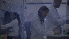 Center technician tapping tablet and initiating circuit graphics overlaying lab for data analysis. Technology, innovation, collaboration, scientific, futuristic, research, digital - Powered by Shutterstock - Get 15% off with code: PIKWIZARD15