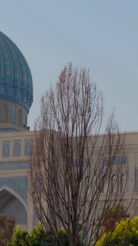 Blue dome of the Center for Islamic Civilization illuminated by evening sun
