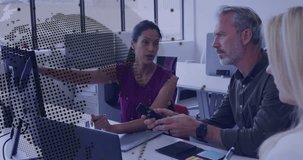 Team meeting in technology, woman pointing data on monitor while man handing smartphone analyzing. Collaboration, teamwork, innovation, digital, modern, analysis, communication - Powered by Shutterstock - Get 15% off with code: PIKWIZARD15